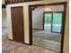 Open living room with sliding glass doors and tiled floors at 1288 Lakewood Ne Dr, Conyers, GA 30013