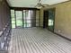 Enclosed porch with ceiling fan and view of backyard at 1288 Lakewood Ne Dr, Conyers, GA 30013