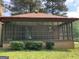 View of screened porch, perfect for enjoying the outdoors while staying protected at 1288 Lakewood Ne Dr, Conyers, GA 30013
