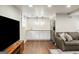 Basement with a convenient wet bar, ample counter space, and a modern refrigerator perfect for entertaining at 2341 Elmwood Se Cir, Atlanta, GA 30339