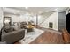Inviting finished basement features sofas, a stylish rug, stairs and dog house underneath the stairs at 2341 Elmwood Se Cir, Atlanta, GA 30339