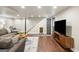Finished basement with entertainment center, gray walkout door, and under-stairs dog house at 2341 Elmwood Se Cir, Atlanta, GA 30339