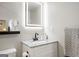 Bathroom featuring granite countertop, sink and LED mirror at 2341 Elmwood Se Cir, Atlanta, GA 30339
