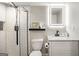 Bathroom featuring a tiled shower, granite countertop and an LED mirror at 2341 Elmwood Se Cir, Atlanta, GA 30339