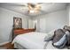 Comfortable bedroom featuring hardwood floors, comfortable bedding, and access to a bathroom at 2341 Elmwood Se Cir, Atlanta, GA 30339