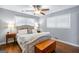 Cozy bedroom with a tufted headboard, ceiling fan and windows providing natural light at 2341 Elmwood Se Cir, Atlanta, GA 30339
