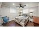 Cozy bedroom with modern lighting fixtures, hardwood floors, and a comfortable bed setup at 2341 Elmwood Se Cir, Atlanta, GA 30339