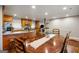 Spacious dining area featuring wooden table set, wooden flooring and access to the kitchen at 2341 Elmwood Se Cir, Atlanta, GA 30339