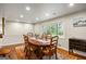 Open dining area with wooden table, natural light, and wooden floors, perfect for gatherings at 2341 Elmwood Se Cir, Atlanta, GA 30339
