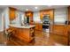 Well-equipped kitchen features granite countertops, stainless steel appliances and custom wood cabinets at 2341 Elmwood Se Cir, Atlanta, GA 30339