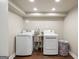 Functional laundry room with modern washing machines and a utility sink at 2341 Elmwood Se Cir, Atlanta, GA 30339