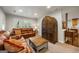 Inviting living room featuring a comfortable leather sofa and stylish wooden coffee table, perfect for relaxation at 2341 Elmwood Se Cir, Atlanta, GA 30339
