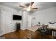 Functional office space with tv, desk, and hardwood floors, ideal for remote work at 2341 Elmwood Se Cir, Atlanta, GA 30339