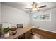 Well-lit home office with sleek desk, hardwood floors, and ample space for productivity at 2341 Elmwood Se Cir, Atlanta, GA 30339
