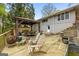Backyard patio with covered outdoor dining and an outdoor fire pit at 2341 Elmwood Se Cir, Atlanta, GA 30339