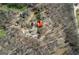 Aerial view of a property with a house, outbuildings, and a private driveway through wooded area at 680 Milligan Creek Rd, Roopville, GA 30170
