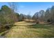 Spacious backyard and creek, perfect for outdoor activities and nature lovers at 680 Milligan Creek Rd, Roopville, GA 30170