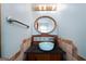 Charming powder room with a vessel sink, unique faucet, decorative mirror, and modern fixtures at 680 Milligan Creek Rd, Roopville, GA 30170