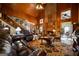 Cozy living room with a brick fireplace, wood paneling, and comfortable leather seating at 680 Milligan Creek Rd, Roopville, GA 30170