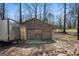 Functional wooden outbuilding, offering practical storage solutions for tools and equipment on the property at 680 Milligan Creek Rd, Roopville, GA 30170