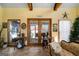 Charming sunroom featuring vintage decor, natural light, and a view of the outdoors at 680 Milligan Creek Rd, Roopville, GA 30170