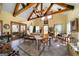 Bright sunroom with wooden beams, tile floors, and expansive windows at 680 Milligan Creek Rd, Roopville, GA 30170