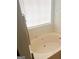 Bathroom featuring a soaking tub with a window providing natural light at 122 Lake Ter, Mcdonough, GA 30253