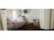 Bedroom featuring a comfortable bed, tv, and natural lighting at 122 Lake Ter, Mcdonough, GA 30253