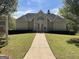 Community clubhouse with well-maintained landscaping and a welcoming entrance at 122 Lake Ter, Mcdonough, GA 30253