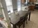 Cozy dining area with dark wooden table set and natural light at 122 Lake Ter, Mcdonough, GA 30253