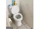A toilet is featured in this image at 122 Lake Ter, Mcdonough, GA 30253