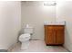 Bathroom has a toilet, single sink vanity, and neutral walls with tile floor at 370 Burton Dr, Douglasville, GA 30134