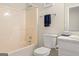 Clean bathroom with a shower-tub combo and a white toilet and vanity at 370 Burton Dr, Douglasville, GA 30134