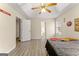 Bedroom features wood flooring, natural light, and a glimpse into the bathroom at 370 Burton Dr, Douglasville, GA 30134