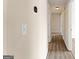 Bright hallway with new flooring, showing access to different rooms in the house at 370 Burton Dr, Douglasville, GA 30134