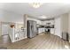Modern kitchen with stainless steel appliances, white cabinets, and new flooring at 370 Burton Dr, Douglasville, GA 30134