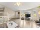 Open-concept living area with large windows, light-colored walls, and sleek flooring at 370 Burton Dr, Douglasville, GA 30134