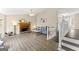Bright living room with a cozy fireplace, stylish gray sofa, and modern flooring at 370 Burton Dr, Douglasville, GA 30134