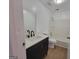 Renovated bathroom with modern vanity, stylish fixtures, and a pristine shower-tub combination at 1433 Butler St, Jonesboro, GA 30236