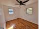 Well-lit bedroom featuring gleaming hardwood floors and a modern ceiling fan at 1433 Butler St, Jonesboro, GA 30236