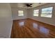 Spacious bedroom with hardwood floors and three windows offering ample natural light at 1433 Butler St, Jonesboro, GA 30236
