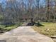 Exterior view of a wooden carport, surrounded by trees at 1433 Butler St, Jonesboro, GA 30236
