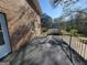 A spacious deck with black metal railing and a brick exterior at 1433 Butler St, Jonesboro, GA 30236