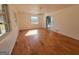 Bright dining room featuring wood floors and a view of the kitchen at 1433 Butler St, Jonesboro, GA 30236