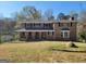 Charming brick home with covered front porch and bay windows; well-maintained lawn at 1433 Butler St, Jonesboro, GA 30236