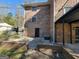 Exterior view of home's basement access and brick patio at 1433 Butler St, Jonesboro, GA 30236