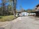 Exterior view of the detached garage, driveway, and multi-story brick home at 1433 Butler St, Jonesboro, GA 30236