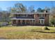Charming two-story brick home with a well-maintained front yard, perfect for a Gathering at 1433 Butler St, Jonesboro, GA 30236