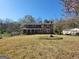 Traditional two-story brick home with manicured lawn and mature trees at 1433 Butler St, Jonesboro, GA 30236