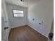 Practical laundry room with connections for washer and dryer, plus a window for natural light at 1433 Butler St, Jonesboro, GA 30236